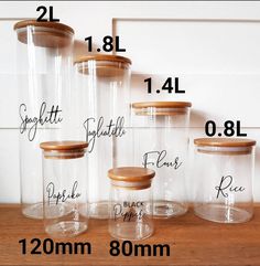 the sizes of glass jars are shown with wood lids