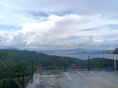 an empty parking lot on top of a mountain