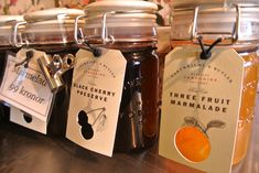 jars filled with different types of fruit preserves