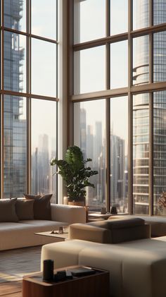 a living room filled with furniture and large windows