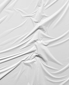 an abstract white background with wavy lines and curves in the form of fabric or cloth