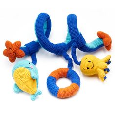 three knitted toys sitting on top of each other in the shape of an octopus