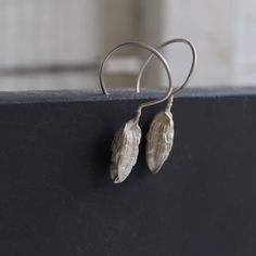 Nature earrings -Sterling silver dangle earrings -Cardamom earrings-Botanical jewelry -Nature jewelry -Gift for her -Gift for chef or cooks Sterling silver cardamom pod earrings nature cast from a real cardamom using the lost wax method. The cardamom soldered in Sterling silver wire hook and has matte finish. Material: Sterling silver Cardamom pod size : 2cm Total length:4cm Please note that every piece you purchase from cyklu is unique and handmade by me. You can make it yours or turn it into g Unique Long Drop Linear Earrings As Gift, Unique Long Drop Linear Earrings For Gift, Unique Linear Drop Earrings Gift, Unique Linear Drop Earrings For Gift, Handmade Sterling Silver Linear Earrings Gift, Handmade Sterling Silver Linear Earrings For Gifts, Sterling Silver Long Drop Earrings As Gift, Nature-inspired Drop Earrings With Lever Back Ear Wires, Nickel-free Sterling Silver Nature-inspired Earrings