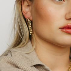 If you’re looking for a bold, statement-making earring that won’t break the bank, then this is it. With its 18k gold-filled Cuban link chain and drop style stud design, our Tatum Chain Link Earring is the perfect way to add some sass and glamor to your outfit. Wear them with jeans and t-shirt or dress them up with a cocktail dress and heels-no matter how you wear them, they’ll be sure to turn heads! Jewelry Cleaning Solution, Hair Perfume, Link Earrings, Cuban Link, Cuban Link Chain, Gold Filled Earrings, Dress And Heels, Gold Filled Jewelry, Cleaning Jewelry