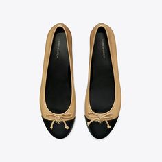 A classic ballet flat crafted in fine leather is finished with a contrast cap-toe and embellished with a bow. A subtle Double T initiates the elegant style as a new brand signature. Designer Flats, Tory Burch Flats, Mule Sandals, Footwear Design Women, Elegant Style, Ballet Shoes, Leather Working, Ballet Flats, Designing Women