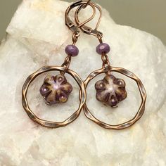 Cottagecore style light purple beads and copper ring dangle earrings. Lightweight Bohemian Czech glass bead dangle earrings with a twisted copper finished ring accent. Beautiful alabaster violet flower beads will add a pop of color to your outfits.   Artisan glass beads produced in small quantities in the Czech Republic Hypoallergenic ear wires (nickel and lead free). Select ear wire style at checkout. A gift for you or someone special, earrings are carded and in an organza bag. Link back to my shop: https://www.etsy.com/shop/JezaJewelry Lavender Flower Dangle Earrings with Copper Rings - Bohemian Earrings with Light Purple Czech Glass Beads - Gift for Her Handmade Bead Jewellery, Stone Bead Jewelry, Bohemian Rings, Handmade Beaded Jewelry, Handmade Jewelry Diy, Bohemian Earrings, Beaded Dangle Earrings, Copper Jewelry, Glass Jewelry