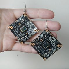 Square cyberpunk earrings is excellent idea for unique gift for geeks or cyberpunk! Large circuit board earrings. Hardware recovered futuristic earrings you can use as cosplay. Geeky earrings is a tech geek gift for herThis textolite computer jewelry hand made from recovered computer parts and not used stainless steel hooks. Hooks is hypoallergenic!Earrings length is 5 cm (2") I use recycled cartoon boxes and paper bags to package your items. With love to our Earth! TAXES ARE NOT INCLUDED IN THE Cyberpunk Earrings, Computer Jewelry, Futuristic Earrings, Asymetrical Earrings, Tech Jewelry, Hardware Jewelry, Earrings Square, Computer Parts, Our Earth