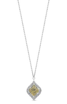 A sterling-silver and 18-karat yellow-gold necklace suspends a swirling filigree pendant alight with dainty diamonds for elegant sparkle. 16" length; 2" extender; 1"Wx 1 3/8"L pendant Toggle closure Total diamond weight: 0.25ct. Sterling silver/18k gold/diamond Imported Diamond Guide 14k Yellow Gold Filigree Necklace, Gold Plated Filigree Pendant Necklace, Collectible Yellow Gold Filigree Necklaces, Luxury Filigree Pendant Necklace, Yellow Filigree Pendant Jewelry, Filigree Pendant Necklace, Diamond Guide, Filigree Pendant, Silver Diamonds