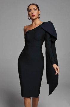 Description: In a one-shoulder silhouette with ruffled details, this midi party dress offers chic style for any special occasion or night out on the town. The Abbey One Shoulder Bandage Dress features a sleeveless bodice on one side with a one shoulder neckline, one long bow topped draped cape sleeve, and a center back slit. The tight bodycon fit lets you flaunt your curves from every angle.• High stretch• Materials: Bandage (90% Rayon, 9% Nylon, 1% Spandex) Care on reverse• Model wearing size S Stile Casual Chic, Winter Wedding Guest Dress, Long Bow, Midi Party Dress, Asymmetrical Midi Dress, One Shoulder Midi Dress, Bandage Midi Dress, Spandex Dress, Runway Dresses