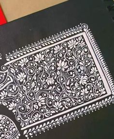 an intricately designed notebook is sitting on a table