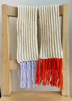 Beautiful off-white scarf with bright orange and periwinkle tassels. Made from a yarn blend that features the warmth of wool and ease of care of acrylic.  Handmade in the Bronx.  Scarf: 80% Acrylic, 20% Wool; Tassels: 100% Acrylic Care: Dry clean only Wool Tassels, Merino Wool Scarf, White Scarf, White Scarves, Gorgeous Fabrics, Wool Scarf, Bright Orange, Bronx, Silk Scarf