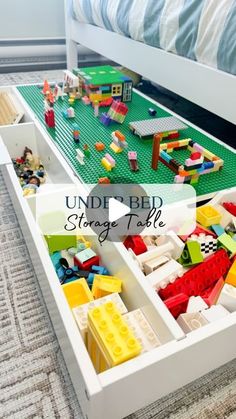 the under bed storage table is filled with legos