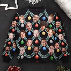 an ugly sweater with the faces of people on it and christmas balls hanging from them