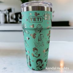 a green yeti cup sitting on top of a counter