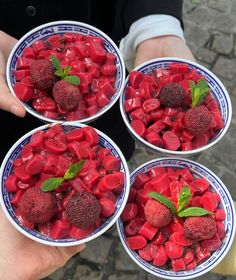 three bowls filled with strawberries and raspberries on top of each other