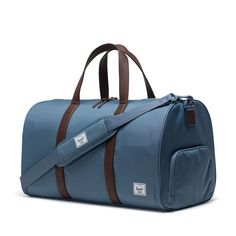 Travel tough and cleverly organized, this is the ultimate road trip duffle, built with our signature shoe compartment for that spare pair. Made with 100% recycled EcoSystem™ fabrics, it fits perfectly the overhead bin or the trunk of your car. EcoSystem™ 600D Fabric made from 100% recycled post-consumer water bottles Tonal stripe EcoSystem™ Liner made from 100% recycled post-consumer water bottles Waterproof zippered closure protects your essentials Low profile vegan leather handles Removable sm Hershel Bags, Herschel Duffle Bag, Pink Mossy Oak, Under Armour Sweatshirts, Camo Purse, Man Stuff, Herschel Supply Co, Herschel Supply, Leather Briefcase