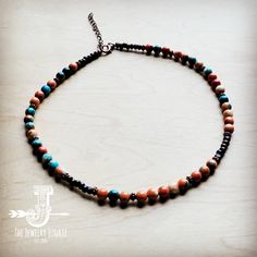 Bring boho vibes anywhere with this colorful beaded necklace! This handmade beaded necklace features a combination of multi-colored beads, wood beads, and copper beads. Worn at the collar bone, this colorful beaded necklace is great for layering with long turquoise necklaces or worn alone as a statement piece. An extender chain and lobster claw clasp make this boho beaded necklace easy to wear. Although this handmade beaded necklace will resemble the photo, no two pieces of our handmade beaded j Long Turquoise Necklace, Boho Beaded Necklace, Boho Choker Necklace, Colorful Beaded Necklace, Turquoise Necklaces, Boho Necklaces, Boho Statement Necklace, Handmade Beaded Necklace, Long Necklace Boho