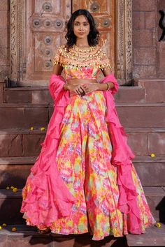 Multi colored attached cancan lehenga with abstract prints. Comes with padded, hand embroidered blouse and a hot pink ruffle dupatta.
Components: 3
Pattern: Hand Embroidered, Printed
Type Of Work: Colorful beads, sequins, glass stones
Neckline: Round
Sleeve Type: Cape
Fabric: Crepe
Color: Multi Color
Other Details: 
Attached lining
Cape style, tassel embroidered blouse
Approx. product weight: 3-4 kgs
Occasion: Destination Wedding - Aza Fashions Ruffle Dupatta, Cancan Lehenga, Hand Embroidered Blouse, Printed Lehenga, Cape Style, Pink Ruffle, Indian Style, Embroidered Blouse, Aza Fashion