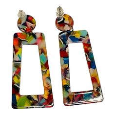 These Dangle Earrings Are A Modern, Stylish Accessory Designed Specifically For Women. Featuring A Striking Multicolored Geometric Pattern With A Mosaic-Like Finish, They Are Sure To Turn Heads And Complement A Wide Array Of Outfits. The Rectangular Shape With A Chic Cutout Center, Attached To A Circular Stud Piece, Creates A Unique And Trendy Look That Exudes Contemporary Elegance. Crafted From Lightweight Acrylic Or Resin, These Earrings Promise Comfort, Even When Worn All Day Long. Discounted Modern Multicolor Dangle Earrings, Modern Multicolor Dangle Jewelry, Bold Multicolor Drop Earrings, Bold Multicolor Drop Earrings Jewelry, Handmade Multicolor Square Earrings, Square Multicolor Earrings For Gift, Multicolor Rectangular Earrings For Party, Geometric Multicolor Earrings As Gift, Geometric Multicolor Earrings For Gift