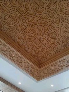 an intricate wooden ceiling in a room