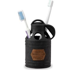 two toothbrushes are in a black container with leather lid and handles, which is also used as a holder for toothbrushes