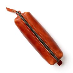 Carries your pens and pencils, lasts a lifetime. Anything else is just overcomplicating it. Here’s a leather pencil case for those who prefer simplicity and function over flashy nonsense. This full-grain leather case will hold all your pens, pencils, and anything else you need to get the job done. Whether you’re sketching blueprints, writing a grocery list, or just need a good place to store your tools, this case will last you a lifetime—literally. No frills, just solid, reliable craftsmanship. Why our English Tan Leather Pencil Case stands above the rest: Made from USA full-grain leather, tanned by Horween Leather in Chicago. It ages like fine whiskey—better with time. Features a YKK solid brass zipper, because we don’t mess around with cheap hardware. Sewn tough with an industrial sewing Diy Leather Dog Collar, Moleskine Cover, Diy Dog Collar, Collars Diy, Leather Mouse, Leather Pencil Case, Leather Mouse Pad, Character Making, Oxblood Leather