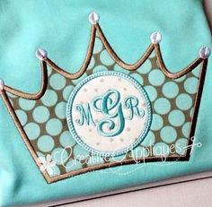 the monogrammed crown has been embroidered on it