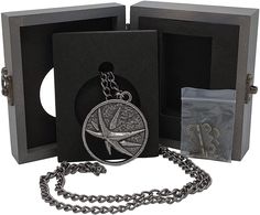 Yennefer's medallion necklace is ideal for any fan of the sorceress from Vengerberg. The intricate details and high quality have been inspected and approved by the best craftsmen in Aedirn. Molded flat relief design; medallion constructed from zinc alloy Yennefer's medallion necklace is ideal for any fan of the sorceress from Vengerberg. The intricate details and high quality have been inspected and approved by the best craftsmen in Aedirn. Molded flat relief design; medallion constructed from zinc alloy, chain is iron. Medallion measures approximately 2 inches in diameter; chain is 30 inches. Packaged in wooden collector's case, measures 3.75 x 4.5 x 1 inches. Ages 15 and up. The Witcher Yennefer, Witcher Yennefer, The Sorceress, Relief Design, Medallion Necklace, The Witcher, Intricate Details, Zinc Alloy, Fan