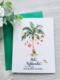 a card with a palm tree on it