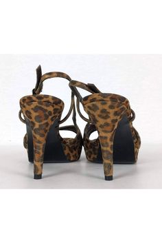 Bring out your inner wild side with these fabulous animal print pumps. Specs of gold on the upper add a shimmering touch. Perfect to pair with any little black dress for a night out on the town. Size 9 M Animal print upper w/ gold specks Leather sole Made in Spain Covered heel Gold-tone side buckle Light wear on sole Platform height .75" Heel height 4.25" Brown Heels For Party In Fall, Brown Heels For Fall Party, Party Platform Heels In Leopard Print, Party Leopard Print Platform Heels, Elegant Leopard Print Heels For Party, Leopard Print High Heels For Night Out, Leopard Print High Heels For Party, Glamorous Brown Party Heels, Chic Leopard Print Heels For Night Out