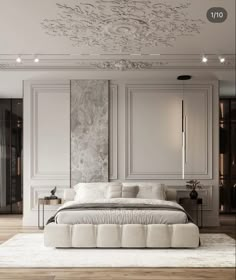 a large white bed sitting in the middle of a room