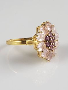 *Size 10.25 *Weighs 5.8 grams *Beautiful statement ring! *Unique & beautiful, marquise cut, genuine Morganite & Rhodolite Garnet. The peachy pink Morganite looks sumptuous with the purplish-red Rhodolite Garnets. *In a beautiful Flower Deisgn. *Set in solid Sterling Silver & plated in 14KT Yellow Gold. *Extremely well made ring. *Rare Find! *In excellent condition with little to no signs of wear or patina. This ring appears as if it was barely worn. There are minor signs of wear. It' Pink Morganite, Rhodolite Garnet, Peachy Pink, Ring Unique, Marquise Cut, Flower Ring, Beautiful Flower, Morganite, Solitaire Ring