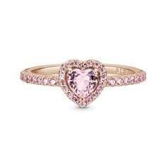 Add a sophisticated touch to your look with the Sparkling Elevated Heart Ring. The ring draws inspiration from the classic Pandora Timeless collection. Hand-finished in 14K rose gold unique metal blend, this piece features a pink heart-shaped central, elevated crystal. Clear cubic zirconia create the halo and decorate half of the ring band, with the Pandora logo inside the shank. Stack this ring with hand-finished styles in sterling silver for a statement mixed metal look. Green Engagement Rings, Pink Heart Rings, Cute Promise Rings, Pandora Rose Gold, Pandora Ring, Pandora Heart, Ring Rosegold, Pandora Hearts, Pandora Rings