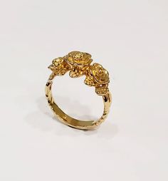 This is my latest ring to my flower collection. The ring is first hand carved in wax then cast into the metal. I love roses and this one especially because 3 roses means I love you. I've paid close attention to detail you will love this ring. Can be ordered in white gold, yellow gold. rose gold, and platinum. Comes is sizes 4 to 10. 100% Money back guarantee. Rose Flower 14k Gold Anniversary Ring, 14k Gold Rose Design Ring, Gold Rings With Rose Design Fine Jewelry, Gold Rings With Rose Design In Fine Jewelry Style, Elegant Gold Rings With Rose Details, Rose 14k Gold Wedding Rings, Yellow Gold Rose Design Promise Ring, 14k Gold Anniversary Rings With Rose Design, 14k Gold Rings With Rose Design For Gift