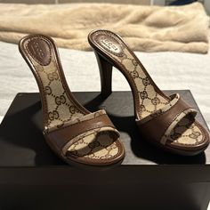 New, Never Worn Gucci Wooden And Leather Heels, Brown And Tan With Gg Monogram. 4 Inch Heels. Size 6 Vintage Gucci Shoes, Designer Brown Heels With Leather Sole, Designer Gucci Heels, Designer Brown Open Heel Shoes, Designer Brown Open Heel Heels, Gucci Brown High Heel Heels, Gucci Brown High Heels, Designer Gucci Brown Heels, Luxury Brown Heels With 4-inch Heel