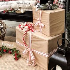 three wrapped presents sitting on top of each other