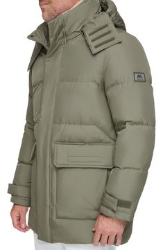 Stay cozy all winter in this parka that features a drawcord hood and a removable bib made with lustrous, lightweight down & feather fill. 33 1/2" length Stand collar; removable drawcord hood Adjustable hook-and-loop cuffs Water-resistant Lined, with down and feather fill 100% polyester Dry clean Imported Down Parka With Pockets For Outdoor, Outdoor Down Parka With Pockets, Functional Down Parka With Detachable Hood, Outdoor Duck Down Parka With Double-lined Hood, Cold Weather Nylon Parka With Padded Collar, Nylon Parka With Padded Collar For Cold Weather, Outdoor Puffer Parka With Down Filling, Outdoor Down Puffer Parka, Outdoor Puffer Down Parka