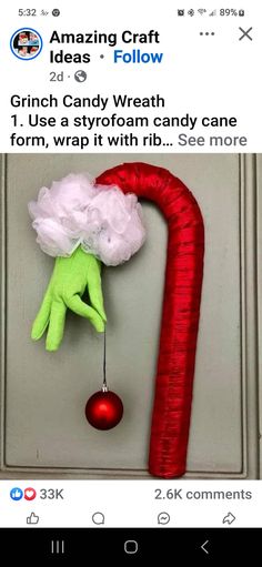 an elf's hand hanging from a door handle with the caption grinch candywrath i use a styrofoam candy cane to form, wrap it with hb see more