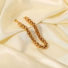 Crafted with an intricate wheat chain design, this bracelet combines the durability of 18k gold plating with a refined aesthetic. Its elegant, intertwined links offer a sophisticated touch to both casual and formal ensembles. Traditional Weaving, Contemporary Chic, Chain Design, Gold Details, Gold Plating, Chain Bracelet, Wheat, My Jewellery, Gold Filled