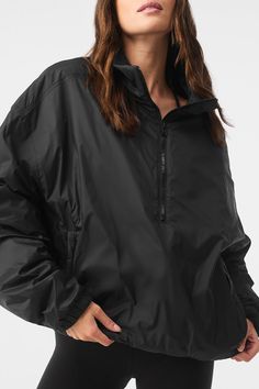 Running to your workout in the rain? Reach for the Latitude Pullover. It’s lightly filled (for a touch of warmth) with functional details like a half-zip collar, zippered side pockets, banded cuffs and a banded hem. Fitwise, it’s generous and oversized. And it’s made from 100 percent nylon—the kind that’s durable, swishy and ready to face the elements. Black Technical Windbreaker For Fall, Technical Black Windbreaker For Fall, Black Waterproof Windbreaker In Athleisure Style, Black Waterproof Athleisure Windbreaker, Black Half-zip Techwear Windbreaker, Black Half-zip Windbreaker For Outdoor Activities, Black Nylon Windbreaker With Functional Drawstring, Black Urban Half-zip Windbreaker, Black Half-zip Urban Windbreaker