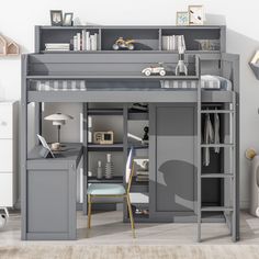 a loft bed with desk underneath it in a child's room