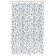 a shower curtain with cactus and starfish print on the bottom, hanging from a metal rod