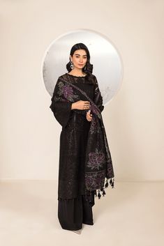 Traditional Black Salwar Kameez with Pakistani Salwar Suit Dupatta is a glamorous attire that will give you a head-turning look on the festive occasion. This beautiful Pakistani Dress is adorned with lavish embroidery and shimmering sequins, making it an epitome of beauty and grace. Embroidered Net Kameez: The kameez has a stunning black shade and it is gracefully emblazoned with embroidery work. Threads and shimmering sequins enhance the glamour of this net kameez. Organza details and motifs gi Black Salwar, Black Salwar Kameez, Suit Dupatta, Pakistani Designer Clothes, Pakistani Suits Online, Pakistani Salwar, Raw Silk Fabric, Unstitched Dress Material, Beautiful Pakistani Dresses