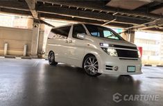 a white van parked in an empty parking garage