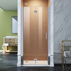 an image of a bathroom setting with glass shower doors and marble flooring on the walls