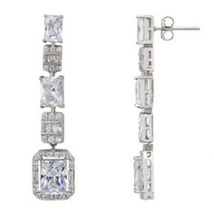 Step into a world of glamour with the Crawford Drop Earrings in Silver White. Exquisitely fashioned  and resplendent with dazzling simulated diamonds, these earrings exude an Art Deco charm that’s both vintage and timeless.  The elegant drop design features five rectangular settings. Each setting is graced with a unique arrangement of gemstones, crowned by a single radiant simulated diamond at the bottom, encircled by a stunning array of baguette-cut stones.   These earrings are designed for bot Luxury Crystal Chandelier Earrings For Formal Occasions, Glamorous Drop Earrings With Brilliant Cut, Elegant Diamond White Linear Earrings For Evening, Glamorous Brilliant Cut Drop Earrings, Glamorous Brilliant Cut Earrings For Party, Formal Linear Earrings With Cubic Zirconia And Prong Setting, Party Earrings With Brilliant Cut Crystals, Luxury Silver Linear Earrings For Evening, Luxury Crystal Diamond Earrings For Evening