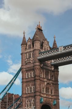 the tower bridge is very tall and has many windows