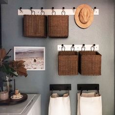 some baskets are hanging on the wall in this bathroom