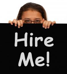 a woman holding up a black sign that says customer service with white lettering on it