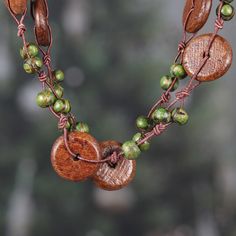 The Indian forest blesses you with a bold complement of bohemian allure. This beaded necklace—presented by Rahul Jain—combines brown and green haldu wood beads, distributing them along a dapper design of soft cotton cords. Indian Forest, Dread Wraps, Cord Wood, Bead Studio, Cotton Jewelry, Cotton Necklace, Autumn Necklace, Brown Jewelry, Braids With Extensions